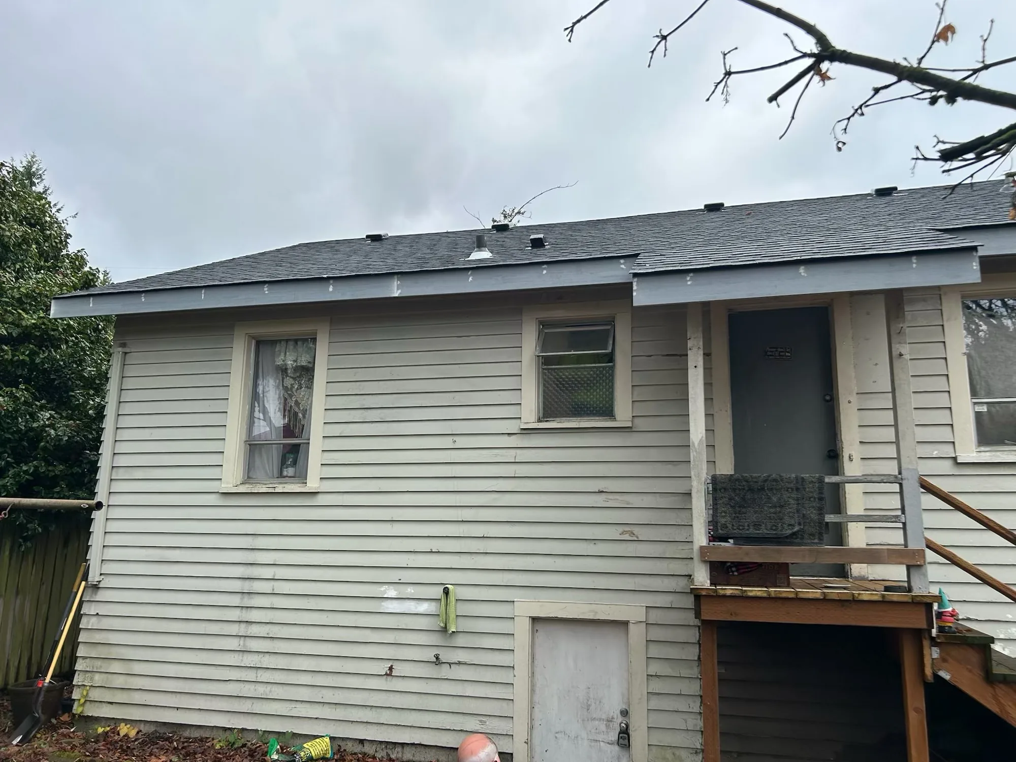 Exterior view of a house with deck after remodel close out